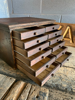 A bank of wooden ‘Lion and Wreath Trademark’ haberdashery draws