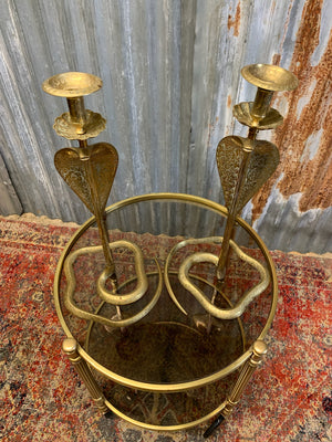 A pair of very large engraved cobra candlesticks