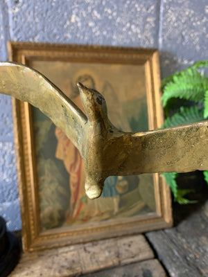 A trio of gilded bronze flocks of birds in flight