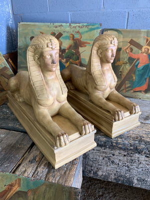A very large pair of monumental plaster sphinx