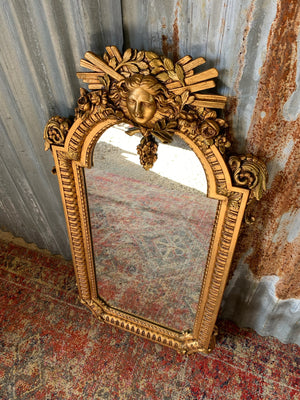 A ‘maiden head’ Louis XIV style gilded mirror