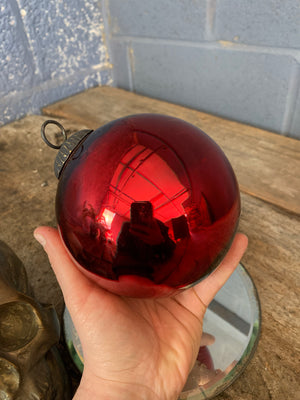 A red glass witch's ball
