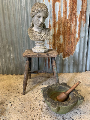 A cast stone classical female bust