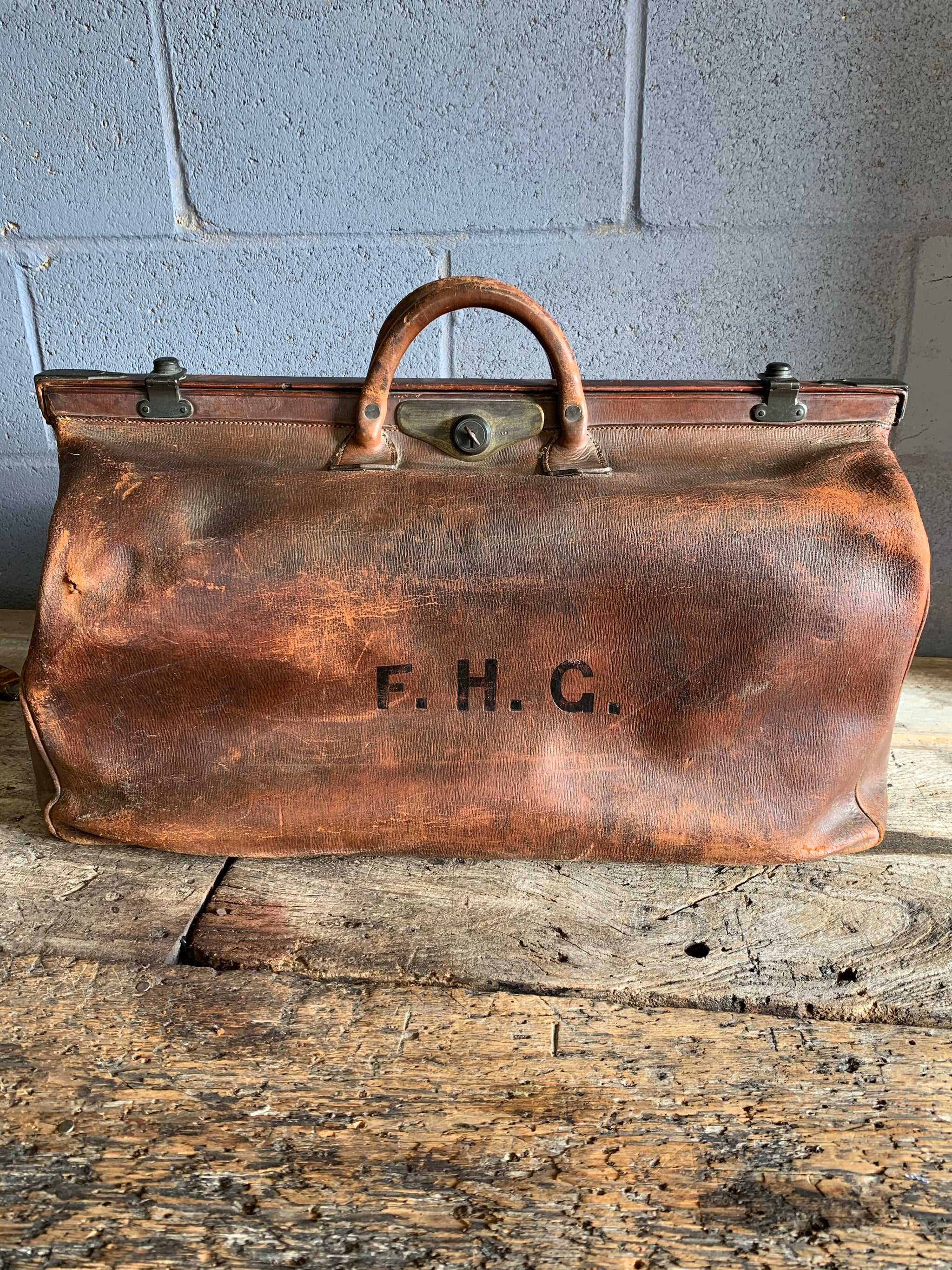 A large brown leather monogrammed Gladstone bag - Belle and Beast Emporium