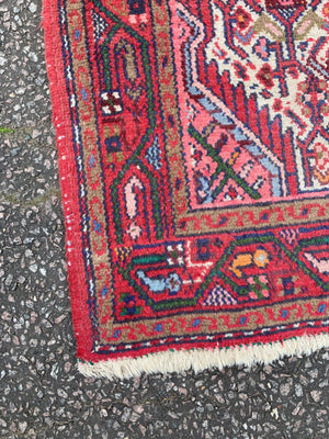 A red ground Persian runner- 217cm x 79cm