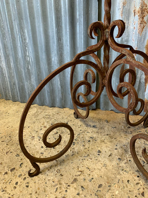 A cast iron garden table with marble top