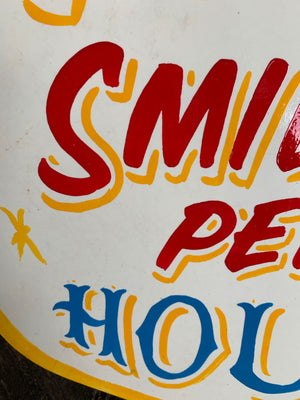 A hand painted fairground advertising sign - 100 Smiles per Hour