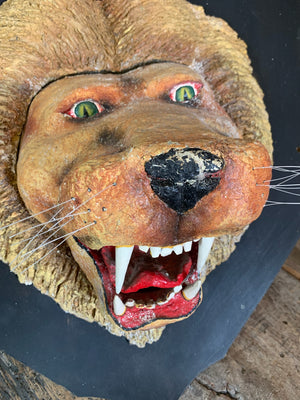 A fairground roaring lion’s head