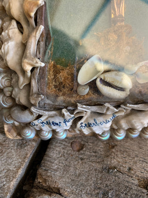 A seashell encrusted wall shrine