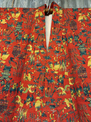 A red silk kimono with interesting pattern