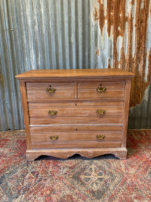 A limed tramline chest of drawers