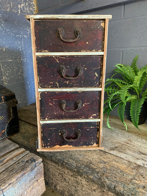 A wooden bank of four drawers