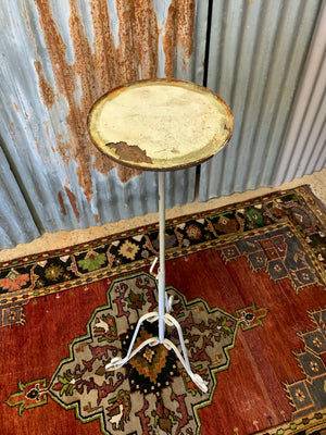 A white metal garden wine table or stand