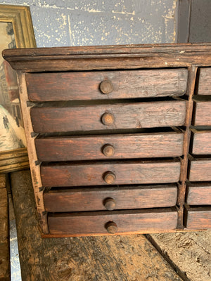 A bank of wooden ‘Lion and Wreath Trademark’ haberdashery draws