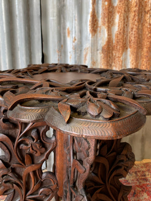 A profusely carved Anglo-Indian table by Jubbar Khan & Son