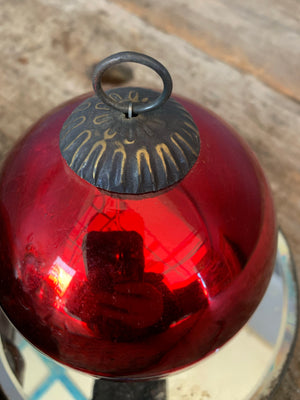 A red glass witch's ball