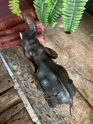 A brown leather elephant figure