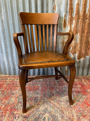 An oak banker's desk chair