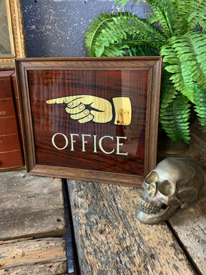 A reverse painted "Office" sign