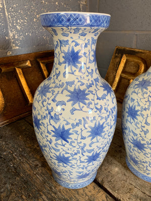 A pair of large hand painted blue and white Chinese vases