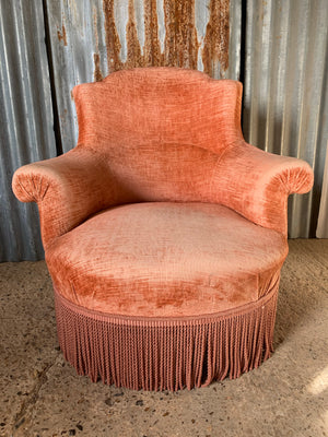 A salmon pink velvet Napoleon III chateau armchair