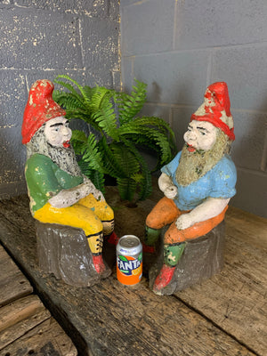 A large pair of cast stone gnome statues