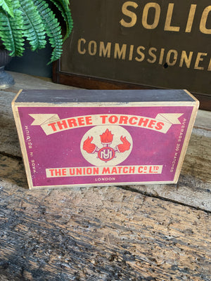 An oversized box of Three Torches matches