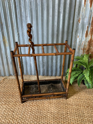 A bamboo stick stand with metal liner