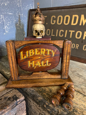 A wooden Liberty Hall/Strict Order Masonic sign