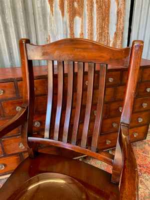A 19th Century mahogany open arm library chair
