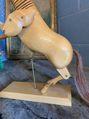 A large wooden horse lay figure