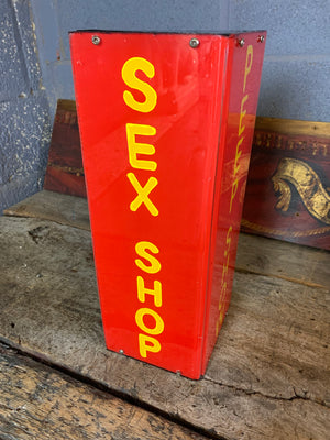 A red Sex Shop/Peep Show trade sign