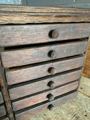 A bank of wooden ‘Lion and Wreath Trademark’ haberdashery draws