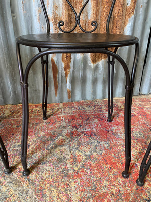 A black marble garden table and four chairs