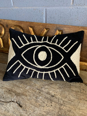 An all-seeing eye embroidered cushion