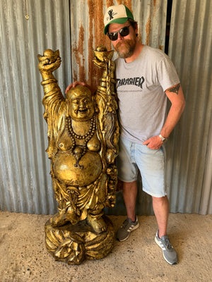 A very large carved wooden gilded laughing Buddha