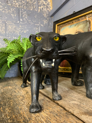 A large mid century black leather panther (56cm)