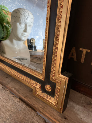 A black and gilt outset or box corner mirror