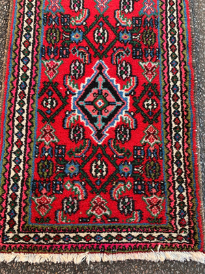 A small hand woven Persian red blue ground rectangular rug