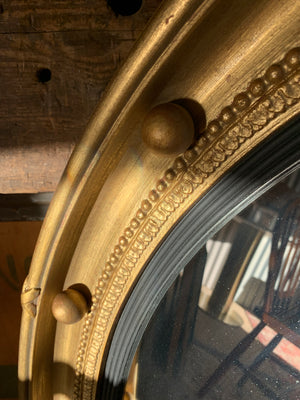 An extra large Regency style convex ball mirror