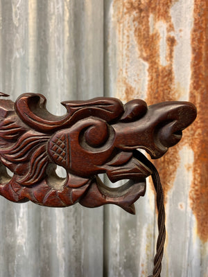 An early 20th Century Chinese carved mahogany dragon table lamp