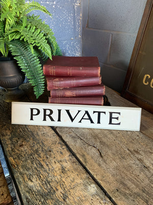 A hand painted wooden 'Private' sign