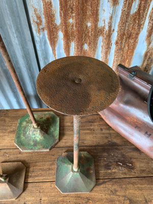 A trio of metal Art Deco shop display stands