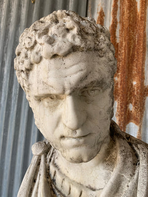 A cast stone bust of Roman Emperor Caracalla on column