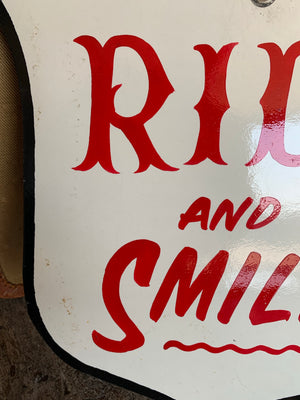 A hand painted fairground advertising sign - Ride and Smile