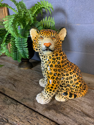 A large Hollywood Regency leopard cub statue