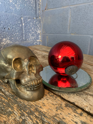 A red glass witch's ball