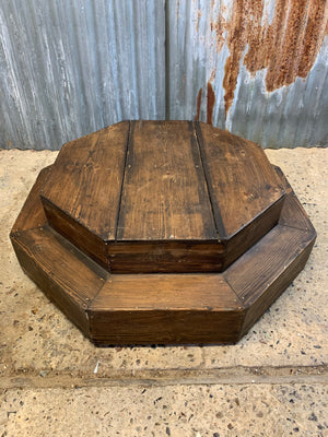 A large wooden octagonal display plinth for a statue or as a shop fitting