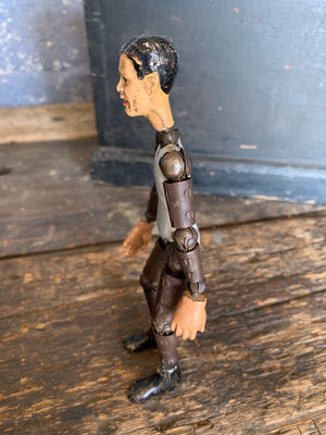 A SABA Bucherer Swiss articulated metal and composition doll 8"
