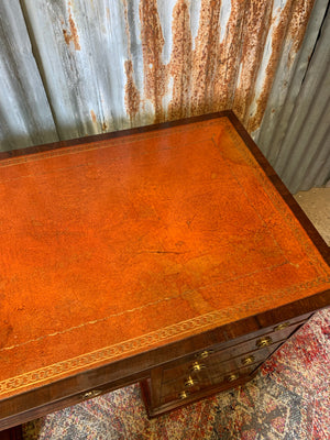 A leather pedestal desk
